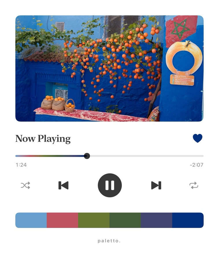 Oranges on a blue wall in a music player frame
