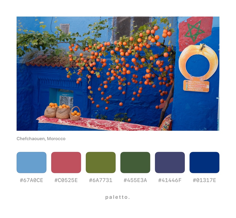 Oranges on a blue wall in Chefchaouen with color blocks and hex codes